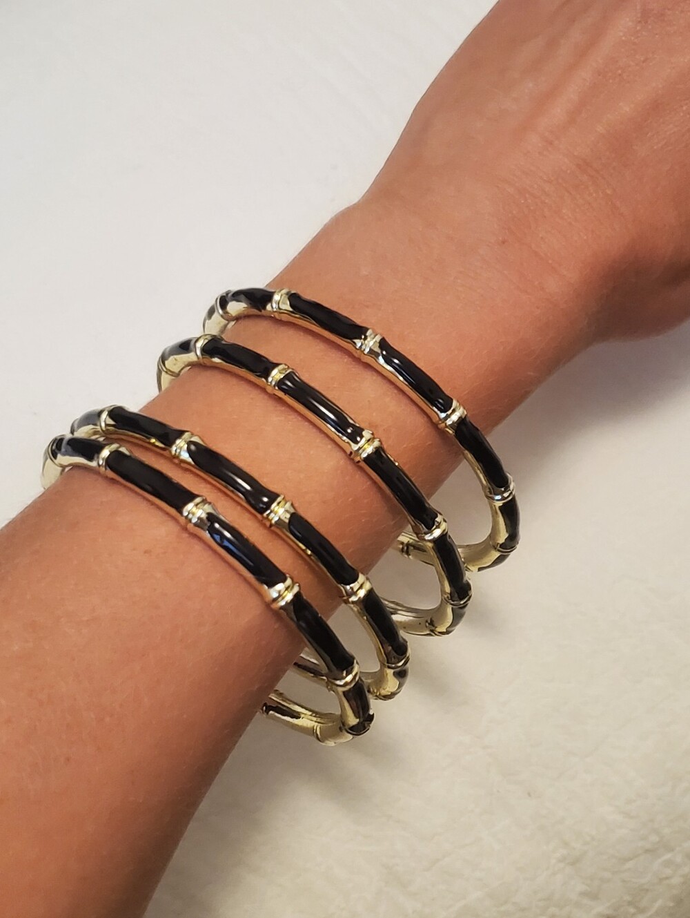 Set Of 4 Gold-Tone Black Enamel Bamboo-Style Bangle Bracelets